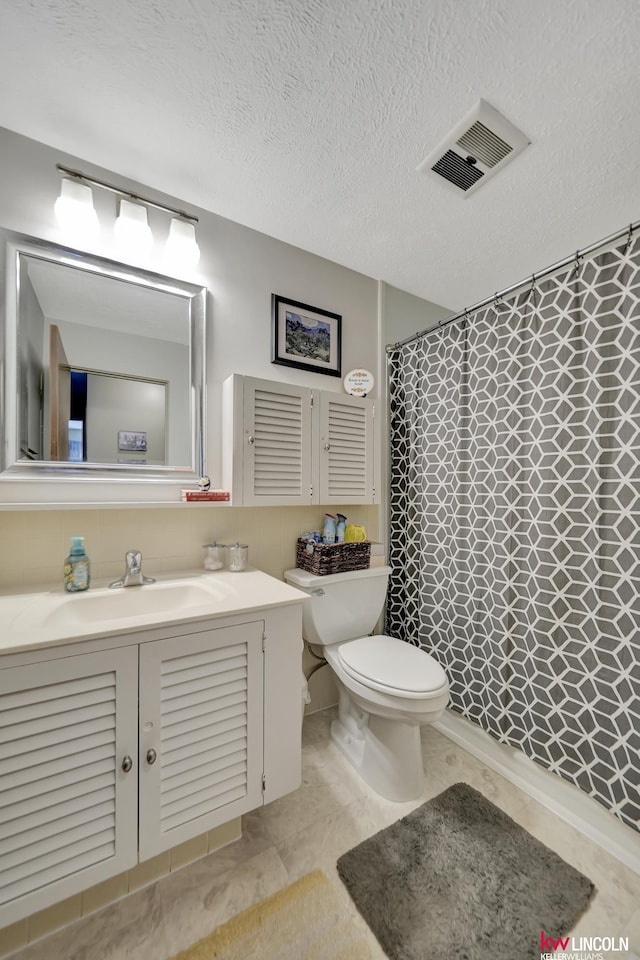 8032 E Avon Ln, Lincoln, NE 68505 - bathroom with vanity and a textured ceiling