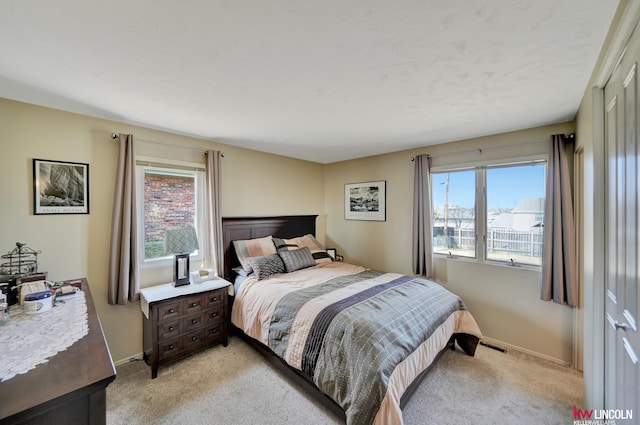 8032 E Avon Ln, Lincoln, NE 68505 - bedroom with light carpet and multiple windows