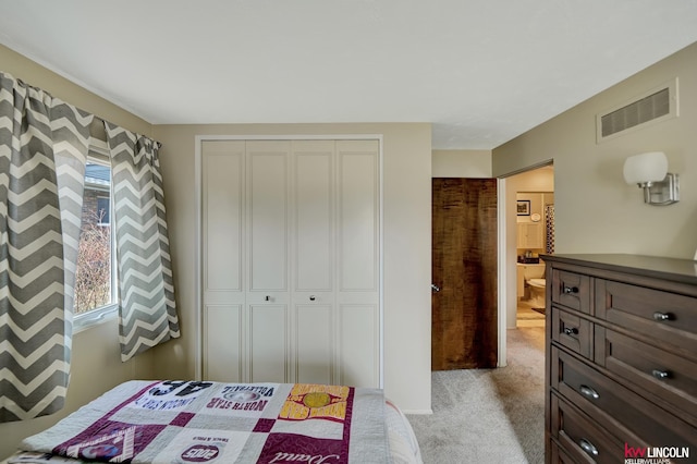 8032 E Avon Ln, Lincoln, NE 68505 - bedroom featuring a closet and light colored carpet