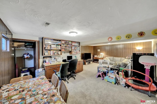 8032 E Avon Ln, Lincoln, NE 68505 - bedroom featuring wooden walls, light carpet, and a desk