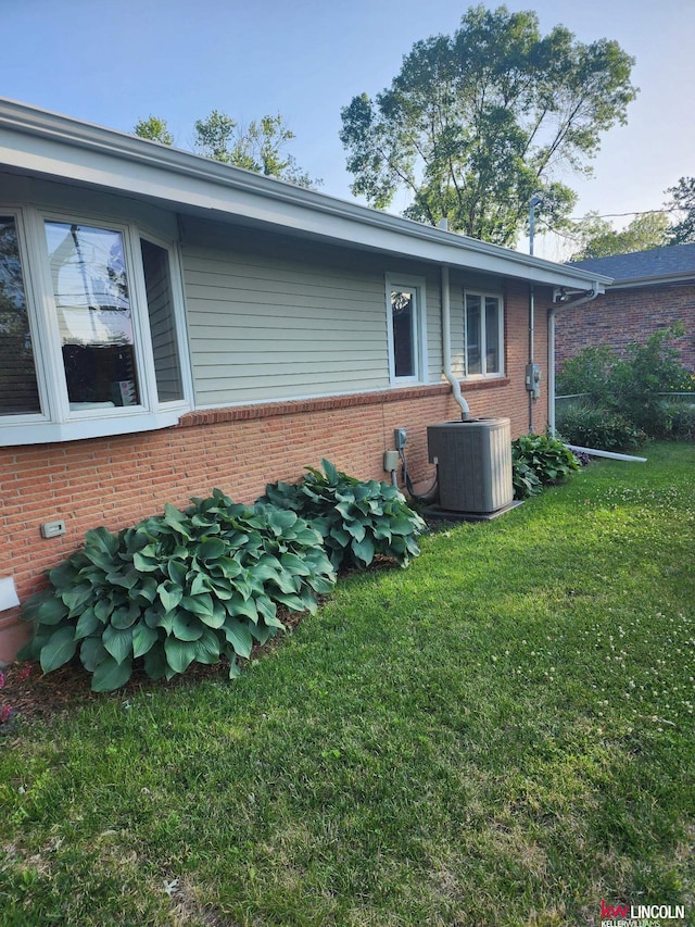 8032 E Avon Ln, Lincoln, NE 68505 - view of home's exterior with a yard and brick siding