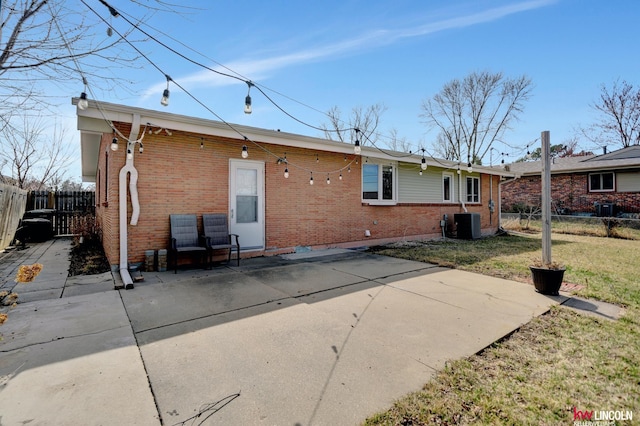 8032 E Avon Ln, Lincoln, NE 68505 - back of house featuring brick siding and a patio area