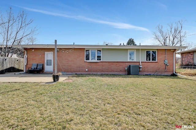 8032 E Avon Ln, Lincoln, NE 68505 - rear view of house with brick siding and a patio area