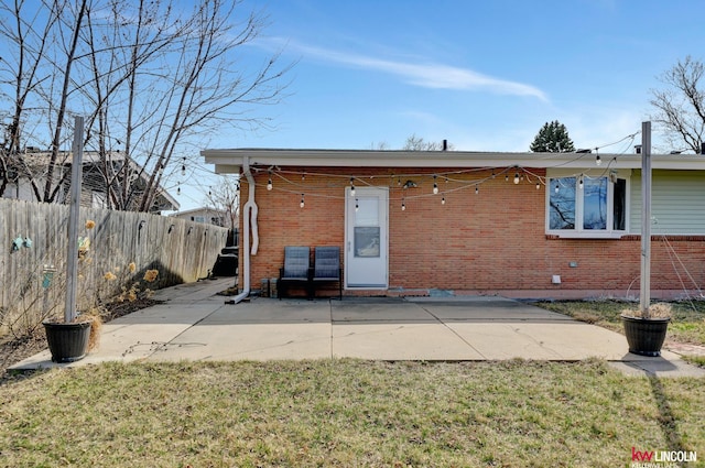 8032 E Avon Ln, Lincoln, NE 68505 - back of property with brick siding and a patio