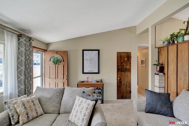 8032 E Avon Ln, Lincoln, NE 68505 - carpeted living room with vaulted ceiling and baseboards