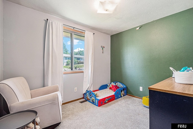 549 Washtington St, Carson, IA 51525 - carpeted bedroom featuring baseboards and a textured ceiling