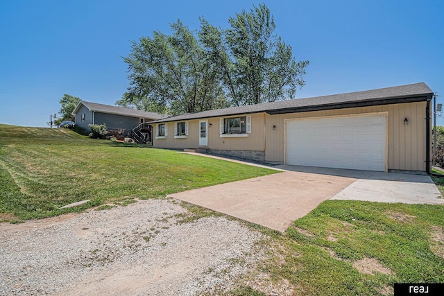549 Washtington St, Carson, IA 51525 - ranch-style home featuring concrete driveway, a front lawn, and a garage