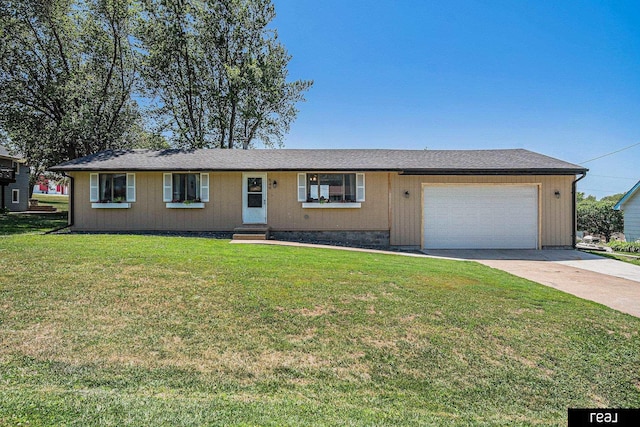 549 Washtington St, Carson, IA 51525 - ranch-style home featuring an attached garage, concrete driveway, and a front lawn