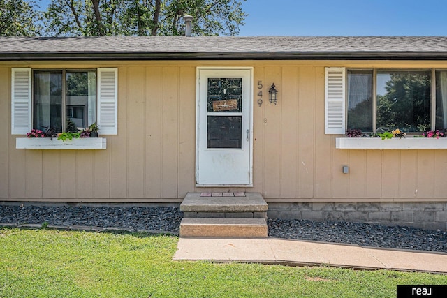 549 Washtington St, Carson, IA 51525 - property entrance with roof with shingles and a lawn