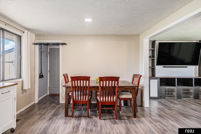 549 Washtington St, Carson, IA 51525 - dining space with wood finished floors, a textured ceiling, and recessed lighting