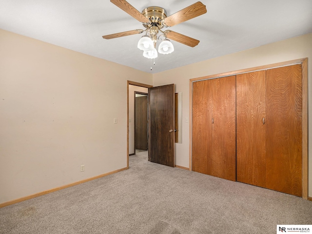 9418 Meredith Ave, Omaha, NE 68134 - unfurnished bedroom with light colored carpet, a ceiling fan, and a closet