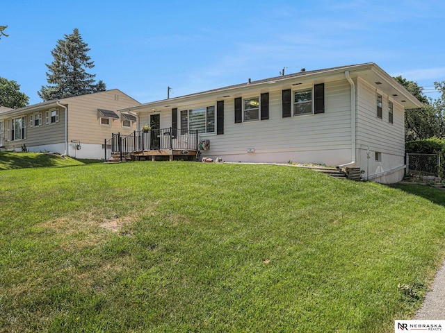 9418 Meredith Ave, Omaha, NE 68134 - view of front of house featuring a wooden deck and a front lawn