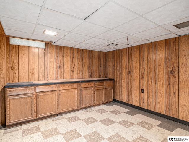9418 Meredith Ave, Omaha, NE 68134 - bar area with light floors, wooden walls, and a drop ceiling