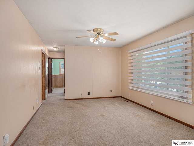 9418 Meredith Ave, Omaha, NE 68134 - unfurnished room with ceiling fan and light colored carpet