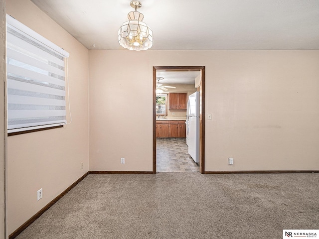 9418 Meredith Ave, Omaha, NE 68134 - unfurnished room featuring light carpet and ceiling fan