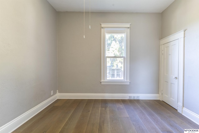 6316 Spencer St, Omaha, NE 68104 - empty room with dark wood-style floors and baseboards