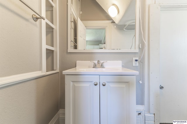 6316 Spencer St, Omaha, NE 68104 - bathroom with vanity and a textured wall