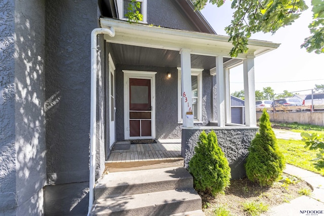 6316 Spencer St, Omaha, NE 68104 - property entrance featuring a porch and stucco siding