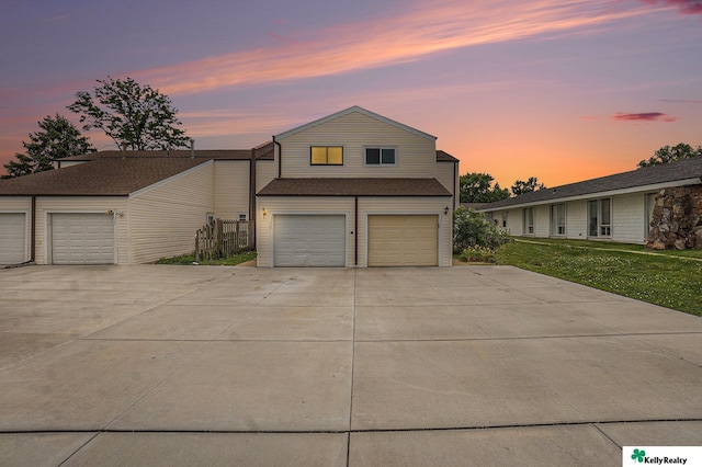 13229 Glenn St, Omaha, NE 68138 - view of front facade with concrete driveway, a garage, and a front lawn