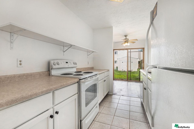 13229 Glenn St, Omaha, NE 68138 - kitchen with white appliances, white cabinetry, light tile patterned floors, light countertops, and open shelves