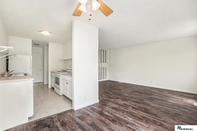 13229 Glenn St, Omaha, NE 68138 - kitchen with white appliances, a ceiling fan, light countertops, white cabinetry, and wood finished floors