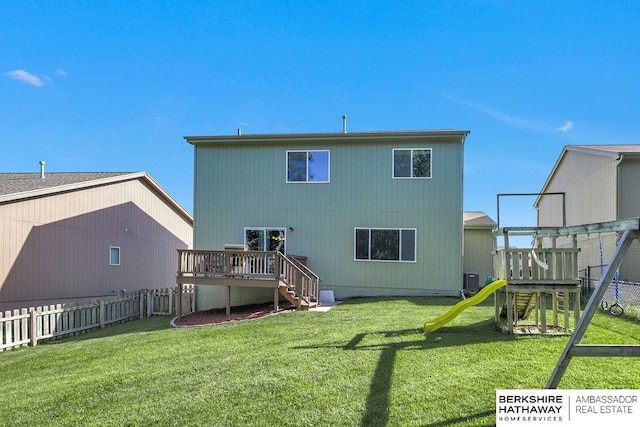 14210 Potter Pkwy, Omaha, NE 68142 - rear view of house featuring a deck, a fenced backyard, a playground, and stairway