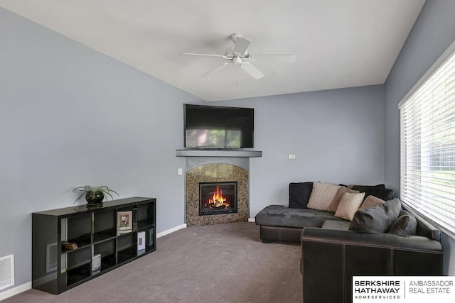 14210 Potter Pkwy, Omaha, NE 68142 - carpeted living room featuring ceiling fan, a glass covered fireplace, and lofted ceiling