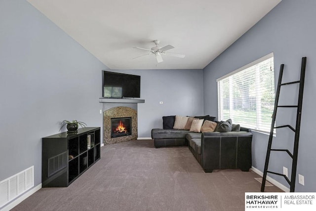 14210 Potter Pkwy, Omaha, NE 68142 - living room with carpet floors, a ceiling fan, a glass covered fireplace, and lofted ceiling