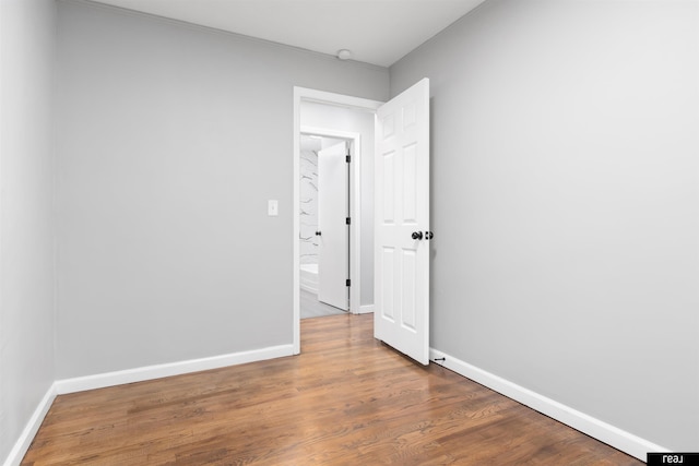 12529 C St, Omaha, NE 68144 - spare room with baseboards and wood finished floors
