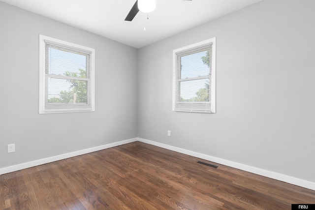 12529 C St, Omaha, NE 68144 - unfurnished room with plenty of natural light, ceiling fan, and dark wood-style floors