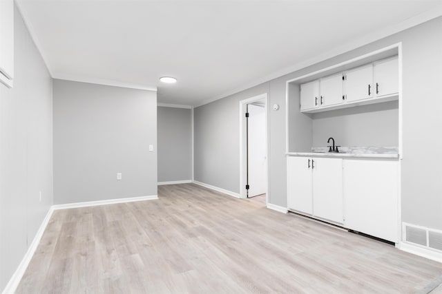 12529 C St, Omaha, NE 68144 - bar featuring a sink and light wood-style floors