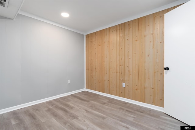 12529 C St, Omaha, NE 68144 - spare room with wood walls, wood finished floors, and recessed lighting