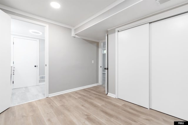 12529 C St, Omaha, NE 68144 - unfurnished bedroom featuring light wood finished floors, a closet, and recessed lighting