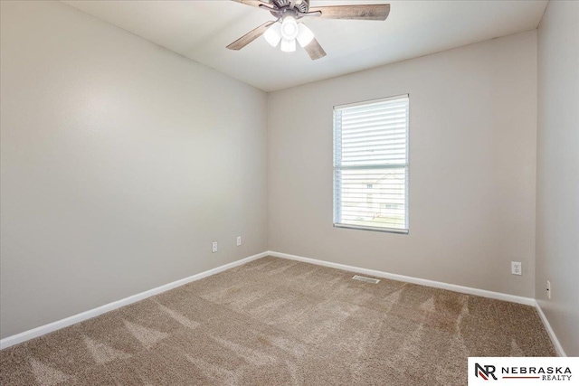 6961 N 89th Ave, Omaha, NE 68122 - empty room with carpet flooring and ceiling fan