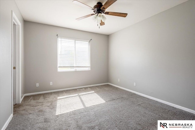 6961 N 89th Ave, Omaha, NE 68122 - empty room featuring carpet and a ceiling fan