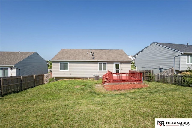 6961 N 89th Ave, Omaha, NE 68122 - back of property featuring a fenced backyard and a wooden deck