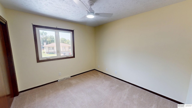 10912 V St, Omaha, NE 68137 - unfurnished bedroom featuring light carpet, a textured ceiling, and ceiling fan