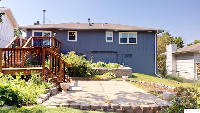 10912 V St, Omaha, NE 68137 - rear view of house featuring stairs, a patio area, and a wooden deck