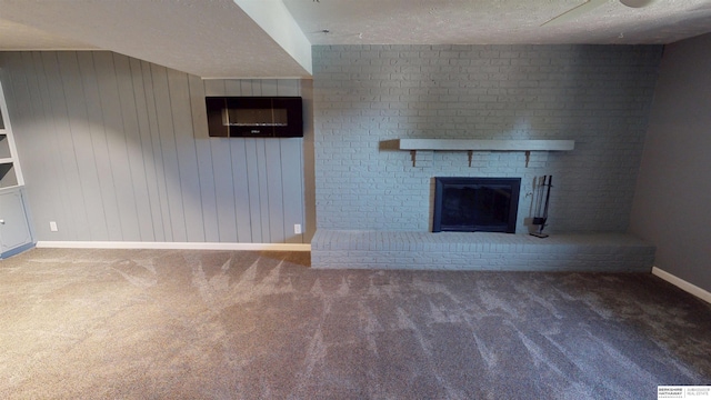 10912 V St, Omaha, NE 68137 - unfurnished living room with carpet, a brick fireplace, a textured ceiling, and wooden walls