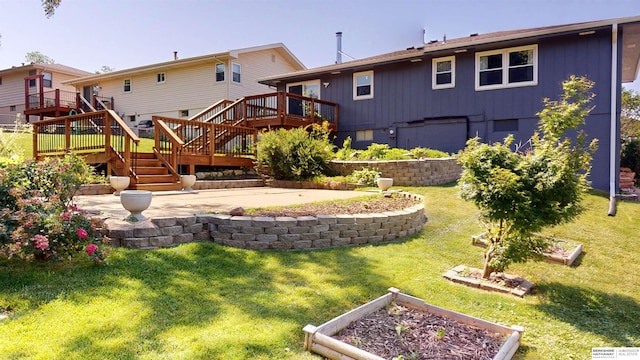 10912 V St, Omaha, NE 68137 - back of property with a vegetable garden, a deck, stairway, and a patio