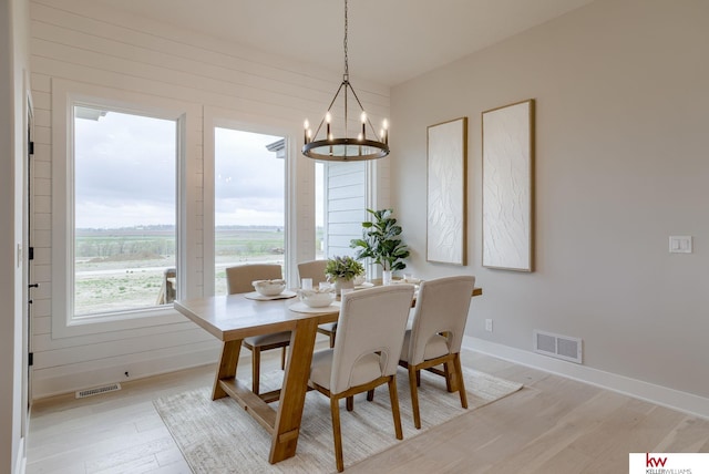 5608 N 212th St, Elkhorn, NE 68022 - dining space with a chandelier and light wood-style flooring