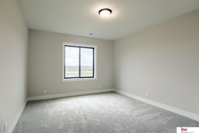 5608 N 212th St, Elkhorn, NE 68022 - carpeted empty room with baseboards