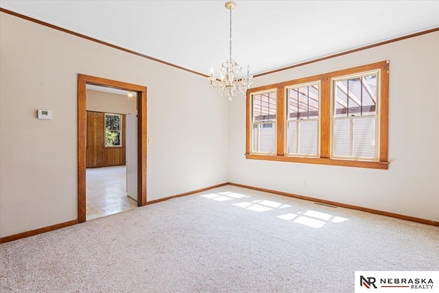 444 W 4th St, Wahoo, NE 68006 - unfurnished room featuring light carpet, a chandelier, and ornamental molding