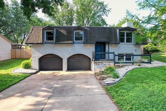 5951 Oakridge Dr, Lincoln, NE 68516 - raised ranch featuring brick siding, an attached garage, concrete driveway, and mansard roof