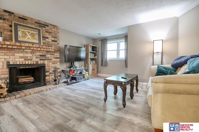 5951 Oakridge Dr, Lincoln, NE 68516 - living room featuring wood finished floors and a brick fireplace