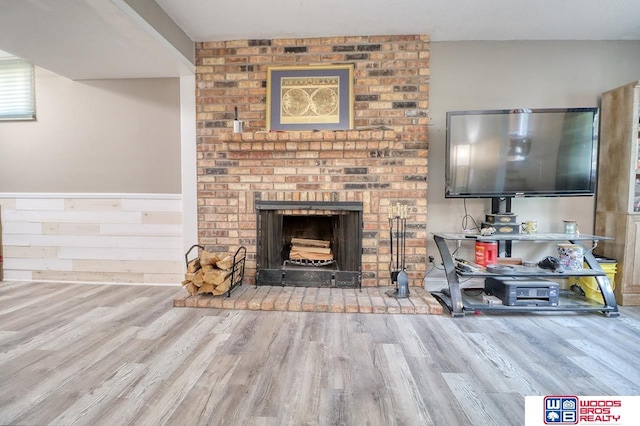 5951 Oakridge Dr, Lincoln, NE 68516 - living area with wood finished floors and a brick fireplace