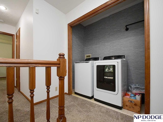 724 N 155th Ave, Omaha, NE 68154 - laundry room with washer and clothes dryer and baseboards