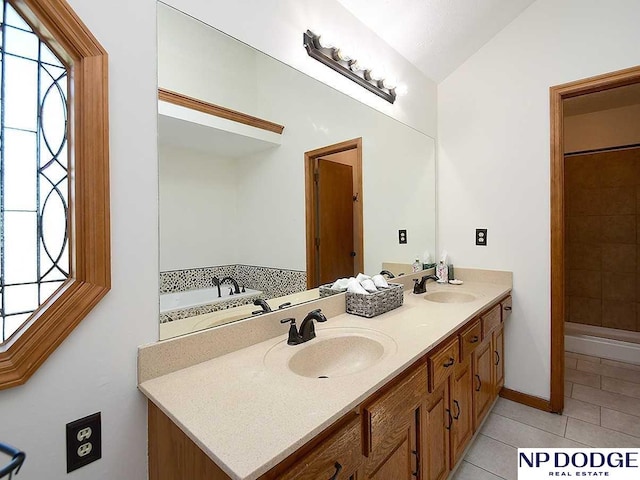 724 N 155th Ave, Omaha, NE 68154 - bathroom featuring tile patterned flooring, double vanity, a tub to relax in, lofted ceiling, and a tile shower