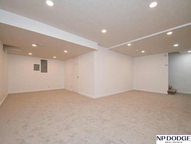 724 N 155th Ave, Omaha, NE 68154 - finished below grade area with electric panel, light carpet, recessed lighting, and a textured ceiling
