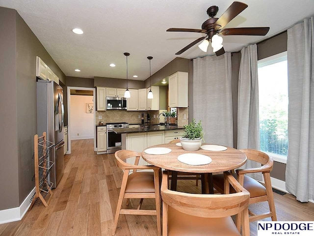 724 N 155th Ave, Omaha, NE 68154 - dining room with ceiling fan, plenty of natural light, light wood-style floors, and recessed lighting